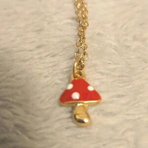#385 Gold tone necklece and Red mushroom